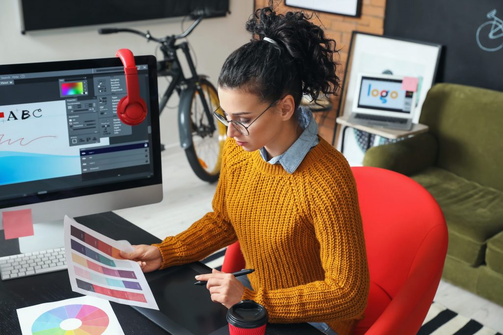 Creative Jobs - Young female designer working in office